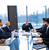 Business meeting taking place inside a corporate venue