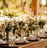 Wedding reception table settings inside a venue