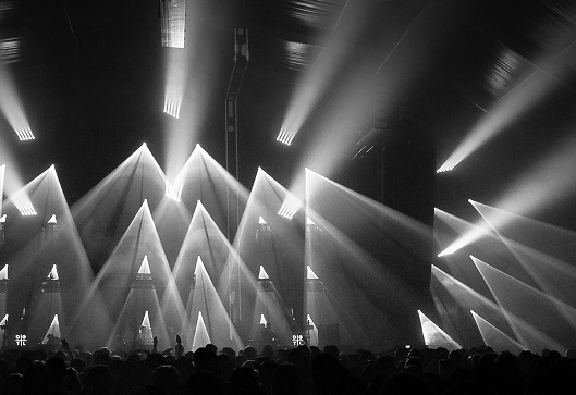 Outdoor event space with stage lighting and seating