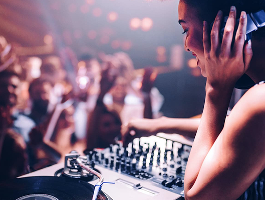 DJ performing at an outdoor patio nightlife event